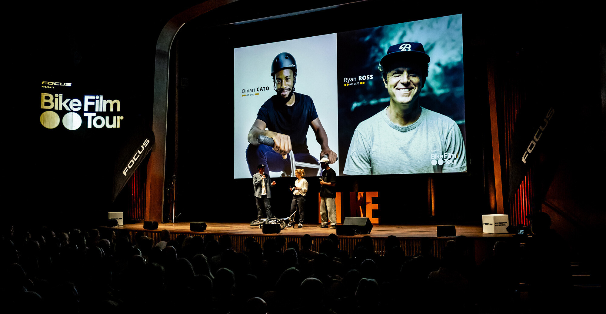 Omari Cato and filmmaker Ryan Ross on stage during the Bike Film Tour event.